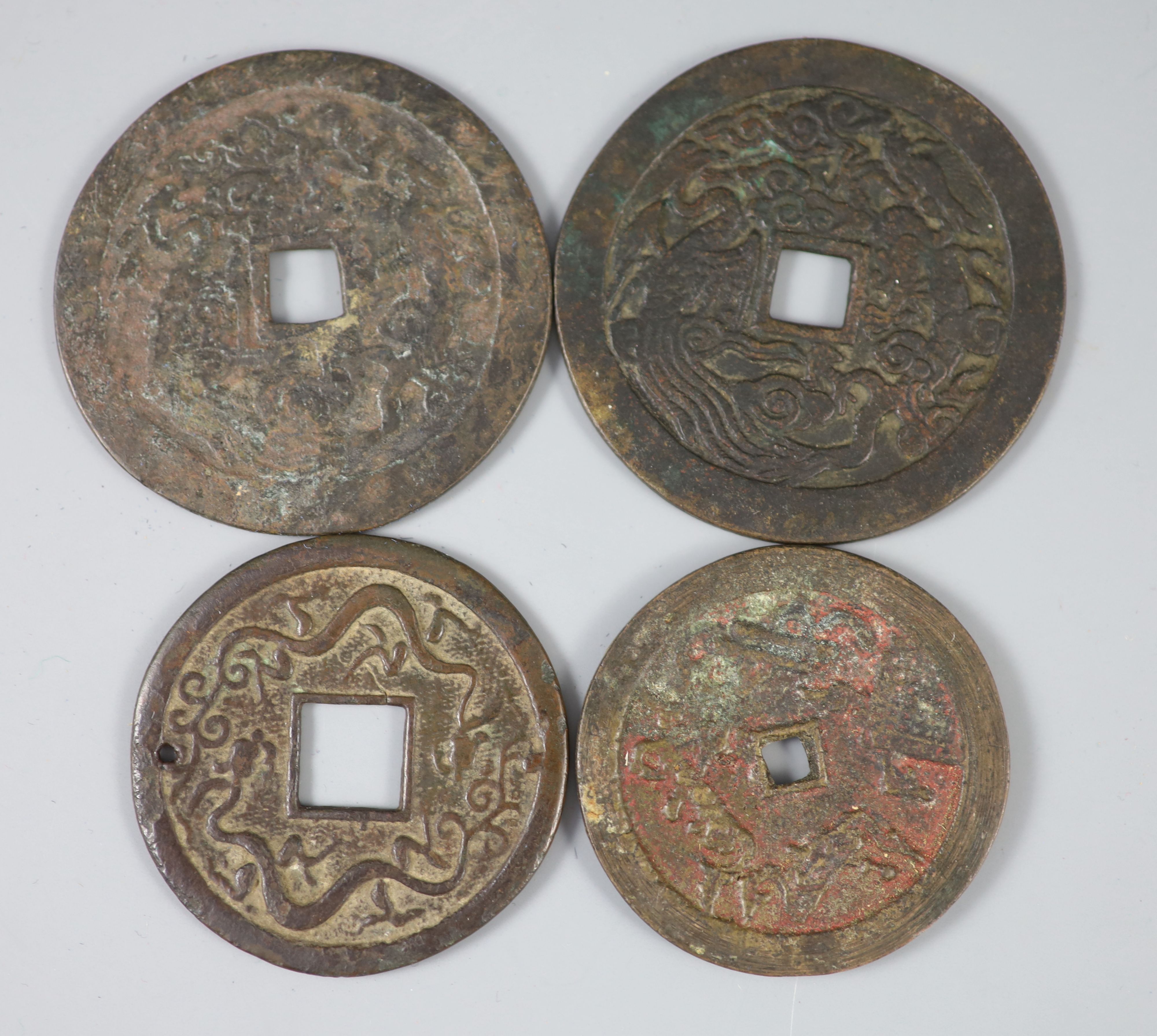 China, 4 bronze or copper charms or amulets, Qing dynasty,